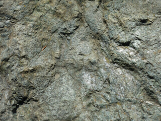 texture of a rough gray wild stone