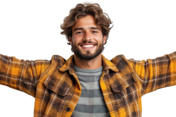 A cheerful young man with curly hair and a beard, wearing a yellow plaid jacket, smiling widely with arms open, isolated on a white background.