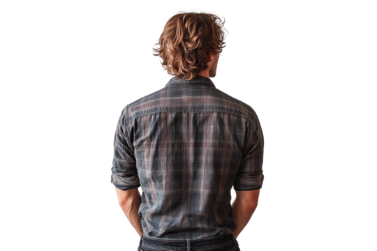 A young man with long hair and a plaid shirt is standing with his back facing the camera, conveying a sense of contemplation and introspection. - Powered by Adobe