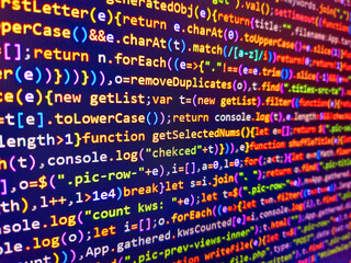 Programming code abstract screen of software developer. Encrypted data. Binary code. Programming concept. Background of program code. Panel informativo en el aeropuerto. Javascript code.