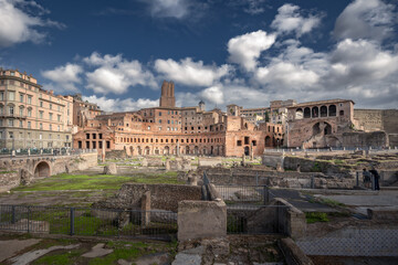 Sunlit Foro di Traiano with remains of roman empire buildings on sunny day, Rome, Italy