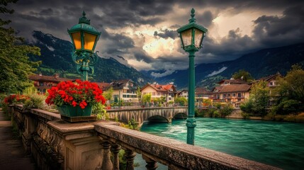 Scenic view of Interlaken, Switzerland with a charming lamppost, vibrant red flowers, turquoise river, and traditional architecture set against dramatic cloudy skies.