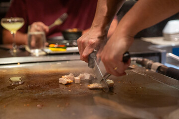 Hibachi Chef Slicing Chicken