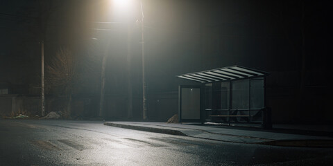 Urban night scene with a misty bus stop and glowing streetlights, emphasizing solitude and cinematic mood.