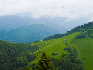 Fototapeta premium Mountain range at the west of Romania. Wonderful springtime landscape in mountains. Panorama of beautiful countryside of Romania.