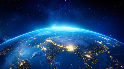Fototapeta premium A glowing view of Earth at night from space, showing the lights of cities scattered across continents.