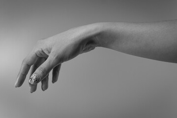 Artistic photo of a woman's hand, hands and fingers, relaxed palm down. Close-up of an elegant palm.