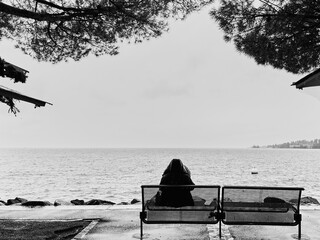 Winter Rain Over Lake Geneva with Woman on a Bench