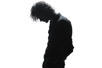 Silhouette of a person looking down, creating an emotional and introspective atmosphere, suitable for concepts of reflection and solitude.