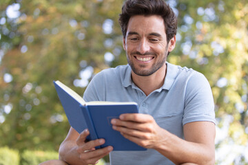 young man traveler reading a book