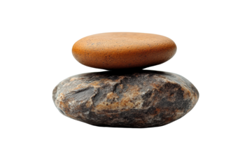 Two balanced stones stacked harmoniously, symbolizing tranquility and balance, isolated on a white background.