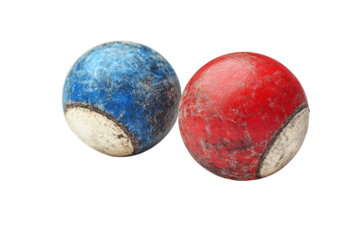Two weathered bocce balls, one blue and one red, exhibiting chips and scratches, isolated on a white background, perfect for gaming enthusiasts.