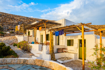 Traditional style Greek apartments at sunrise in Karavostasis port, Folegandros island, Cyclades,...