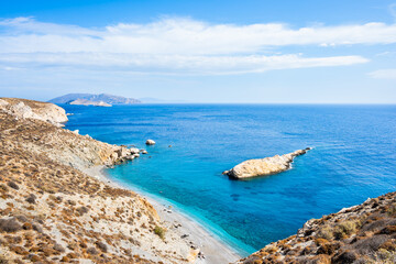 View of beautiful Katergo beach and blue sea from high rock cliff, Folegandros island, Cyclades,...