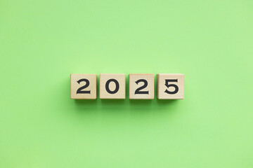 Text 2025 written on wooden cube blocks. Preparation new year 