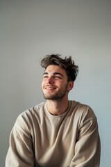 Obraz premium Happy young man smiling, looking up.