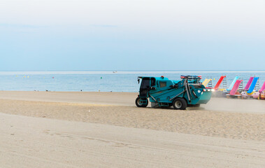 Obraz premium Beach Cleaning Machine on Sand. Copy space.