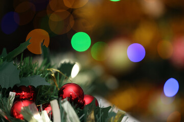 Christmas Tree with holiday decorations and blurred lights background
