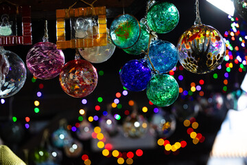colorful glass ornaments on a black background