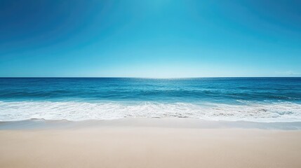 Fototapeta premium Sandy beach meets deep blue ocean horizon