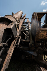 Rusty Excavation Machine Under a Bright Blue Sky