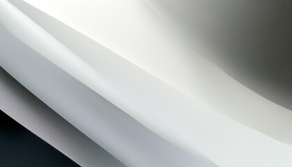 Curved white and gray surfaces reflecting soft light in a minimalist setting