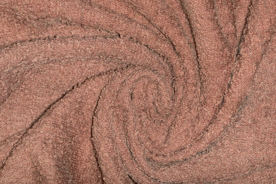 Background made from crumpled twisted cotton towel. Trending color of the year 2025 Mocha Mousse.
