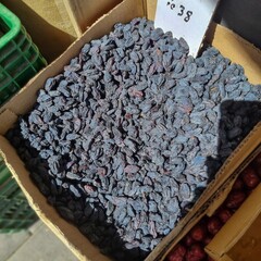 Farmers food market stall with box of organic resins