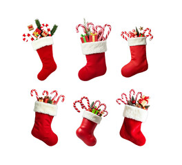 A festive Christmas stocking overflowing with candy canes, small toys, and wrapped gifts, placed neatly against a transparent background.