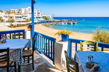Fototapeta premium View of beach from Greek taverna restaurant in Apollonas village, Naxos island, Cyclades, Greece