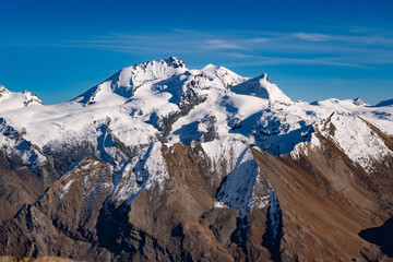 Fototapeta premium Autumn landscape of high alpine mountains in Switzerland with Matterhorn in the background
