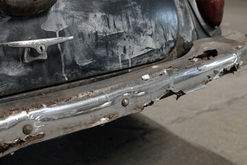 corroded chrome bumper on a classic car