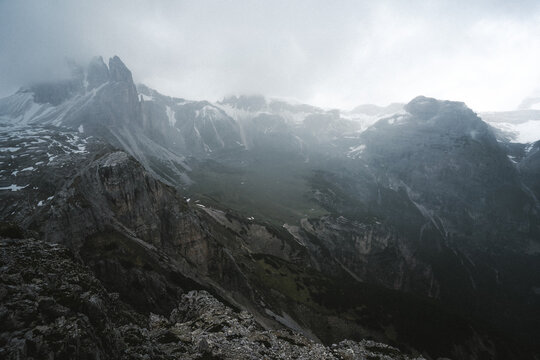 A stunning black and white photograph depicting a majestic mountain range