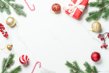 Christmas frame or greeting card on white background. Flat lay christmas composition with holiday...
