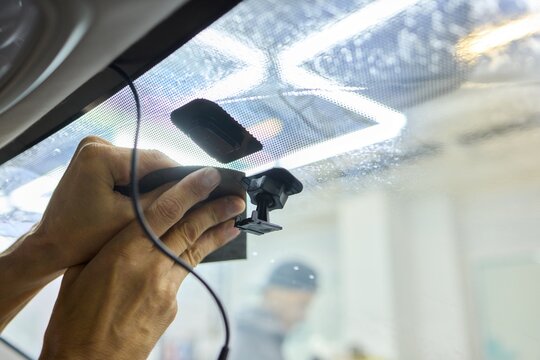Expert car repair service for adjusting and fixing rearview mirror with precision