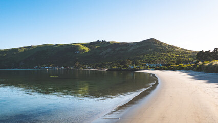 Beautiful ocean sea scenes clear day calm water blue sky Otago peninsula Dunedin New Zealand boats...