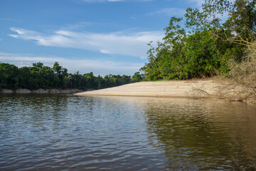 IGAPOS OF THE NANAY RIVER, BLACK WATERS THAT REFLECT THE CLOUDS ON THEIR SURFACE