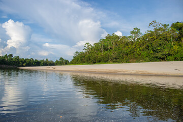 IGAPOS OF THE NANAY RIVER, BLACK WATERS THAT REFLECT THE CLOUDS ON THEIR SURFACE