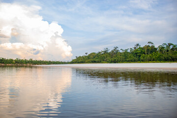 IGAPOS OF THE NANAY RIVER, BLACK WATERS THAT REFLECT THE CLOUDS ON THEIR SURFACE