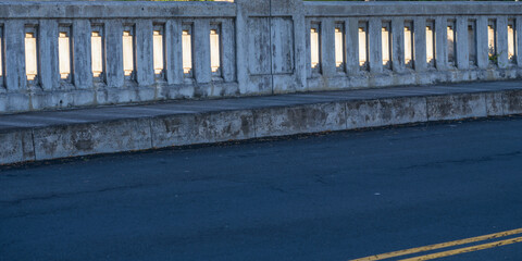 Fototapeta premium Abstract Background of a Vintage Concrete Bridge in an Asphalt Road.