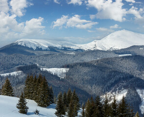 Picturesque winter mountain view from Skupova mountain slope, Ukraine, view to Chornohora ridge and Pip Ivan mountain top with observatory building, Carpathian.