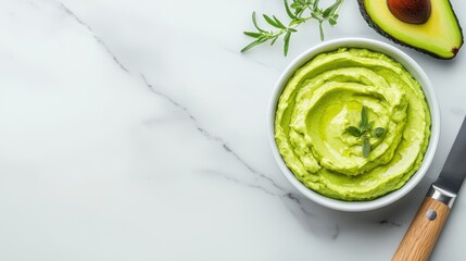 Obraz premium Deliciously Creamy Avocado Spread Poured Generously Into a Bowl with Fresh Herbs for Tasty Snack Options