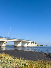 Obraz premium Varela Bridge over the Ria de Aveiro establishes the connection between Murtosa and Torreira, Aveiro, Portugal