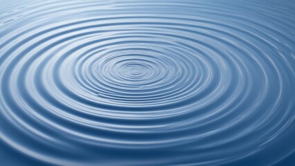 Fototapeta premium Ripples on calm blue water surface in abstract pattern