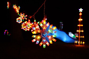 Colorful Christmas decoration lights set up at a local community park. 