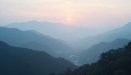 Fototapeta premium Sunset Over Misty Mountains and Valley 