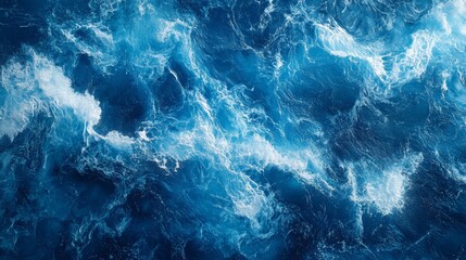 Fototapeta premium Abstract Aerial View of Turbulent Ocean Waves in Deep Blue Shades