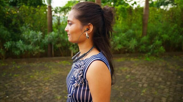Woman On Slow Walk And Listening Music