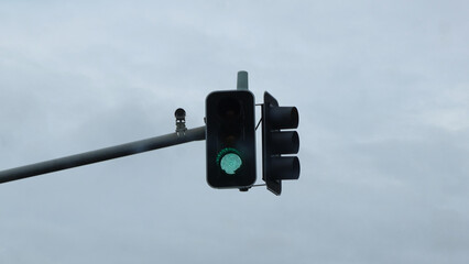 Green traffic light and Surveillance camera 