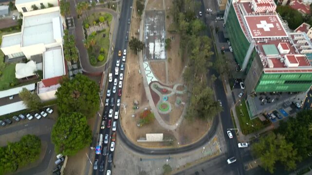Aerial drone footage showcasing a horizontal pan over Lazaro Cardenas Avenue in Guadalajara, capturing the bustling urban landscape
